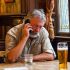 pub landlord on mobile phone pub pint